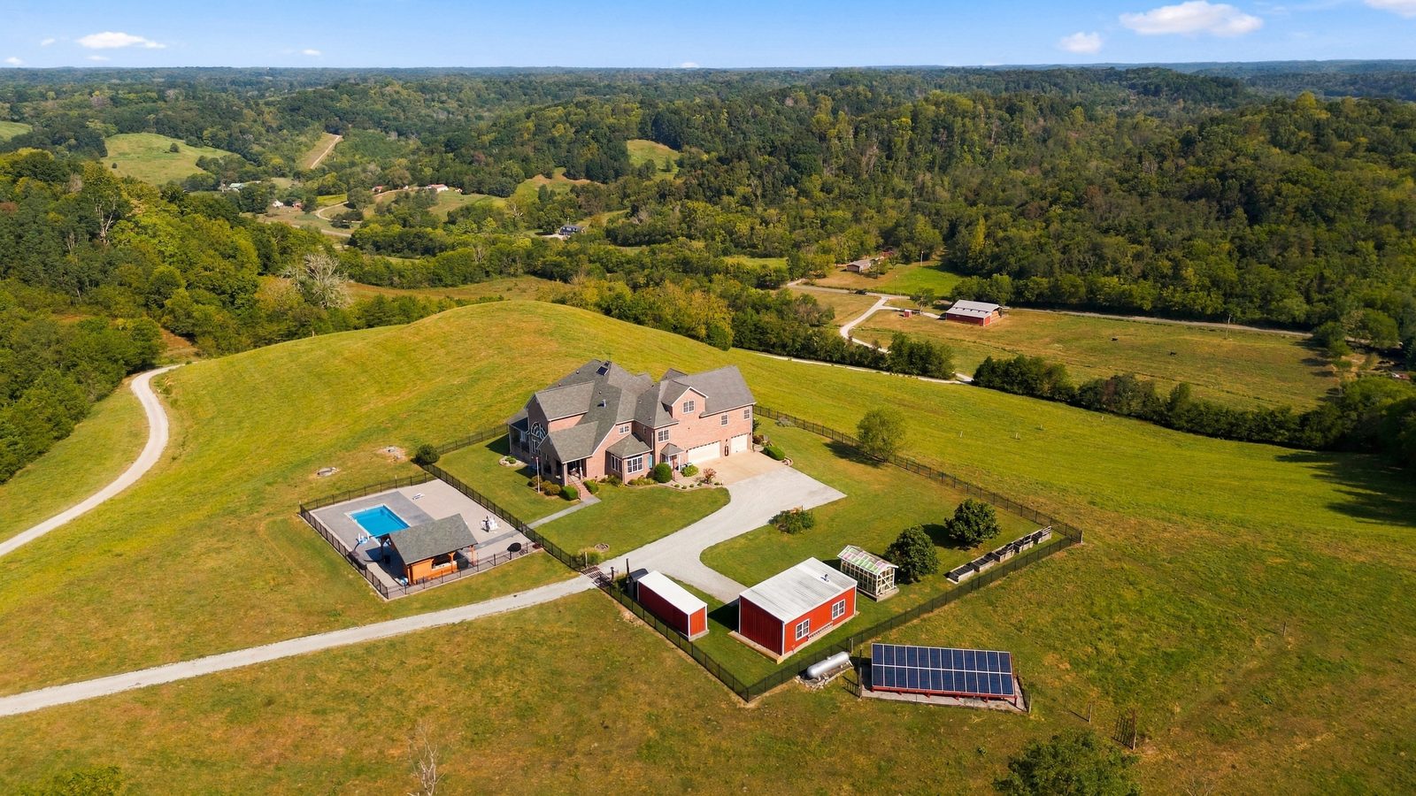 Aerial view of the 53 acre ridge-top farm and its pastures and outbuildings