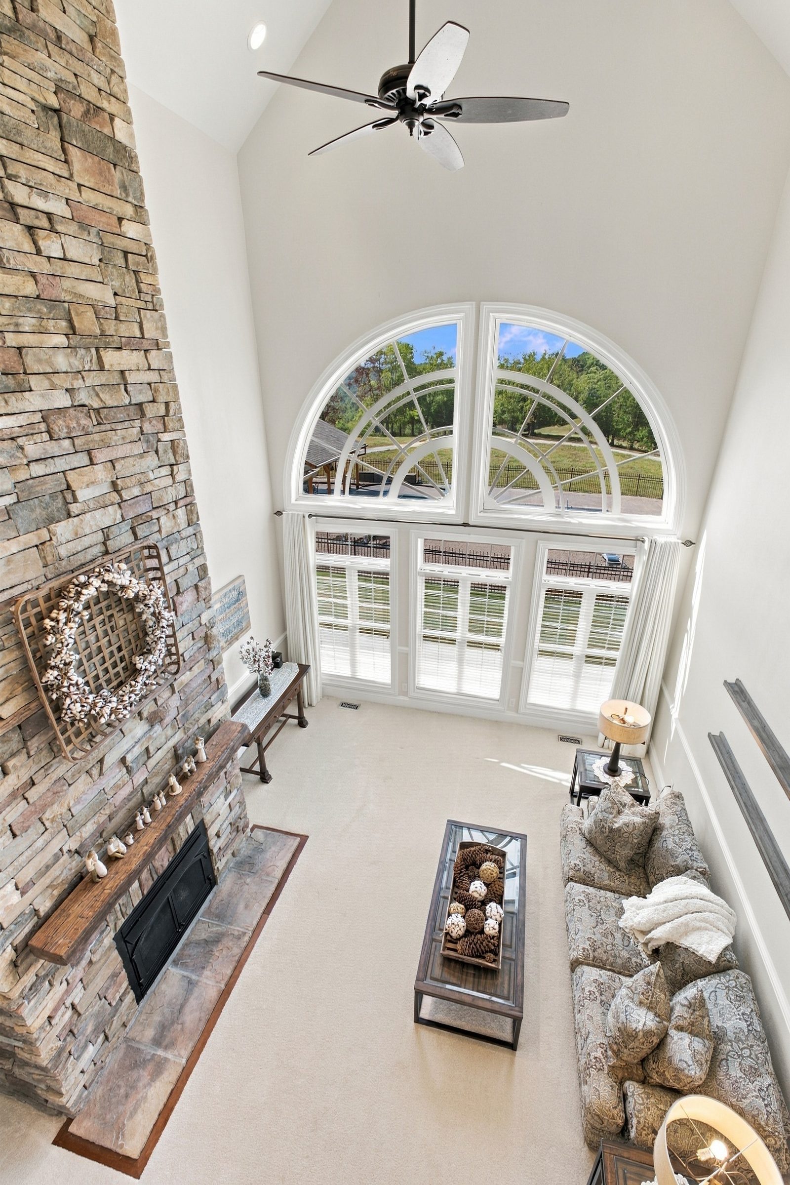 The dramatic two-story great room filled with natural light and framing the ridge views