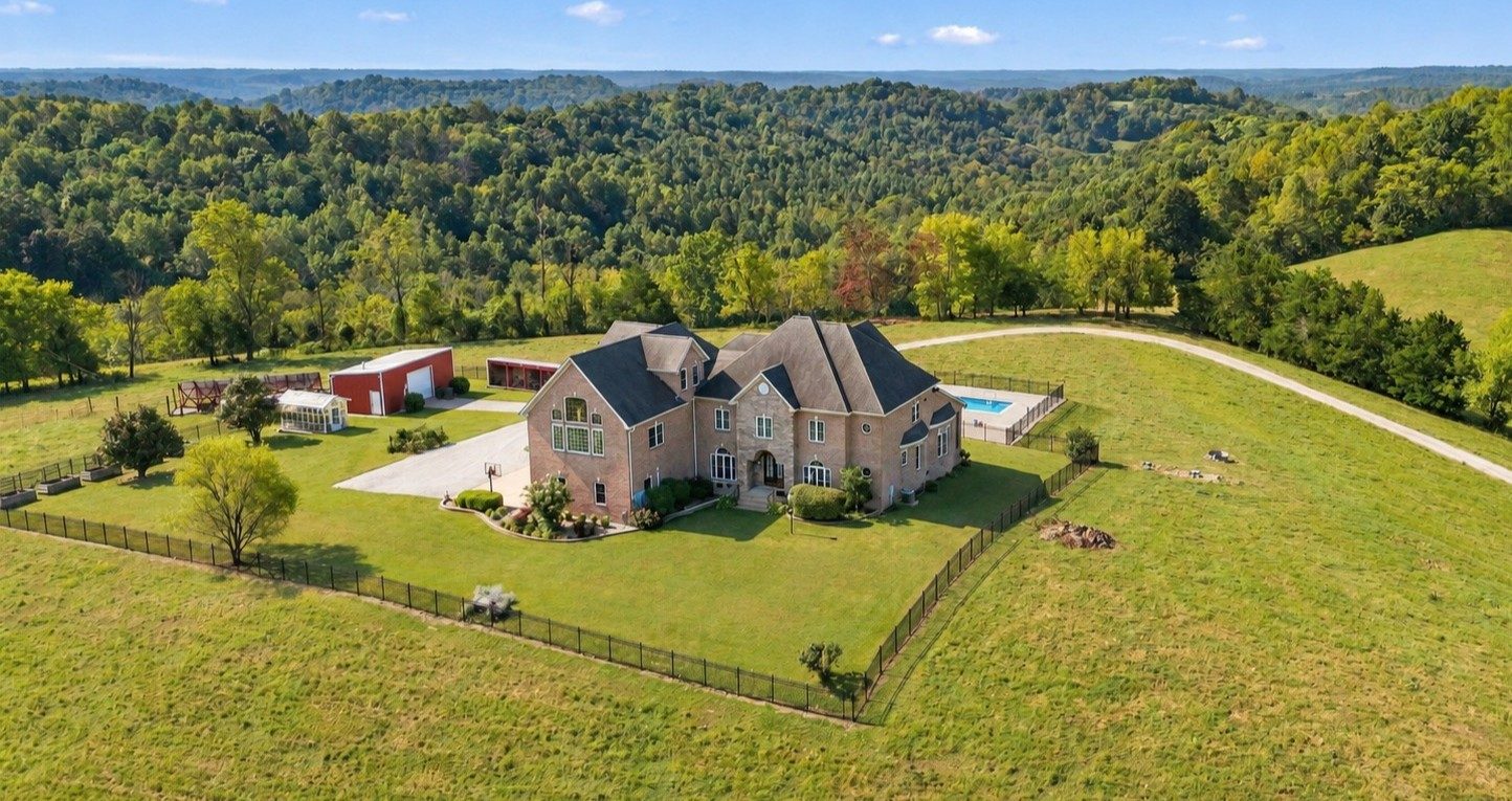 A custom ridge-top farm estate with 360 degree views across the southern Middle Tennessee hills near Pulaski