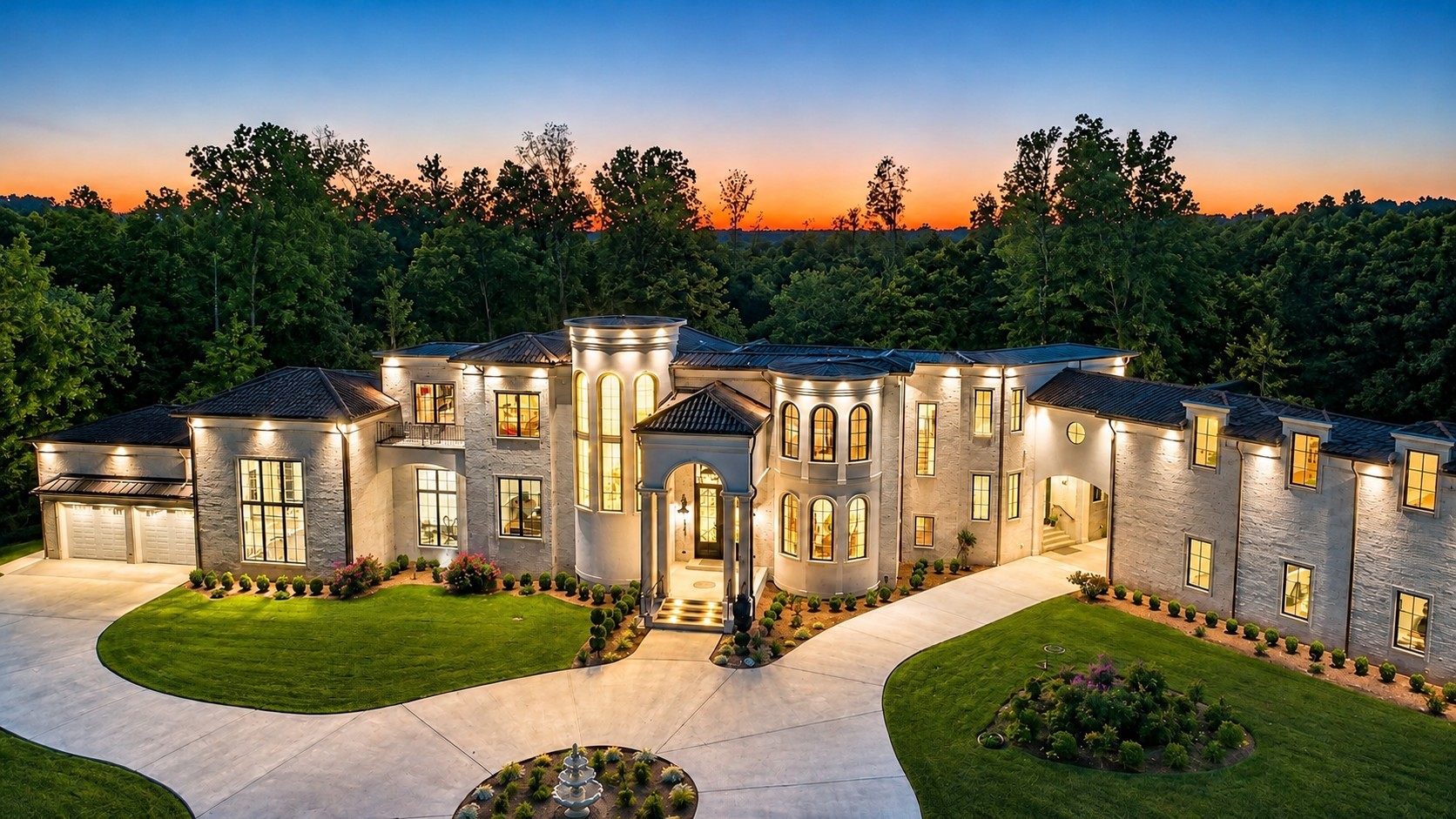 The full front elevation of the estate across its circular motor court